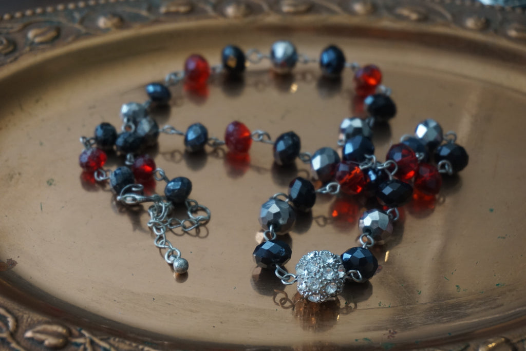 Beaded Necklace with Red, Black, and Silver Accents