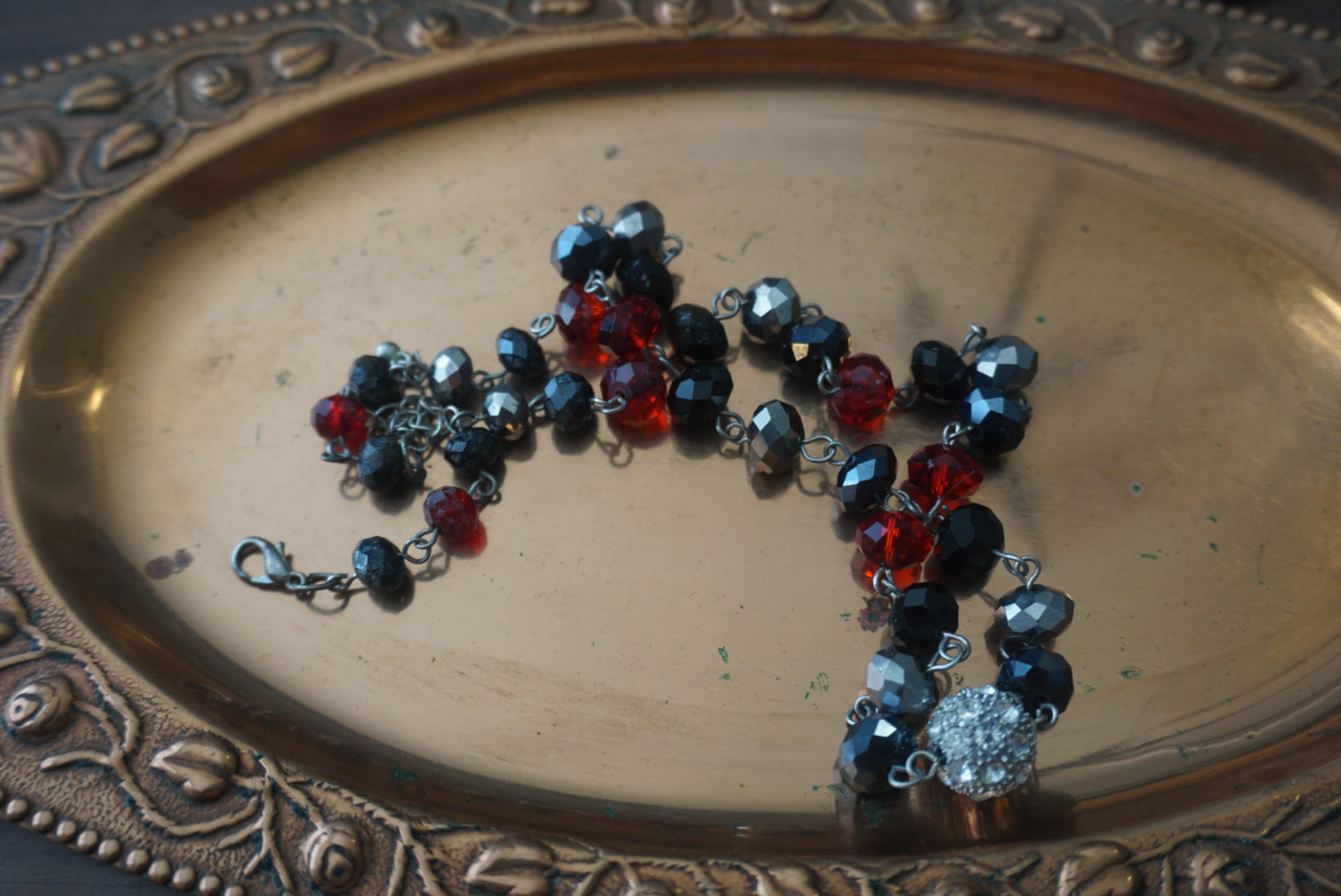 Beaded Necklace with Red, Black, and Silver Accents
