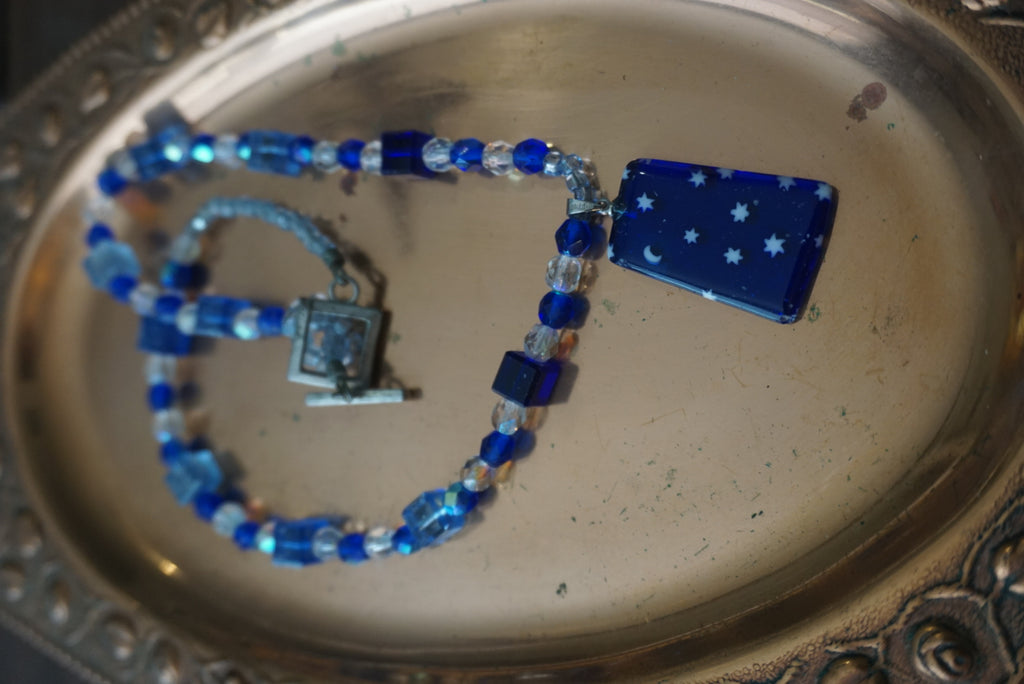 Blue Beaded Necklace with Star and Moon Pendant