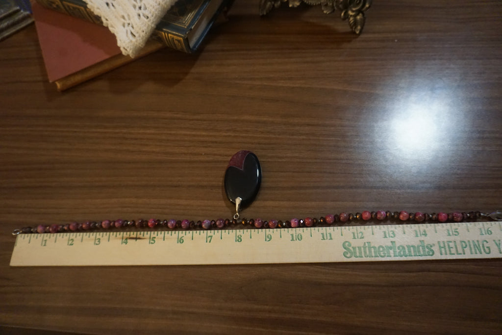 Handcrafted Beaded Necklace with Black Pendant