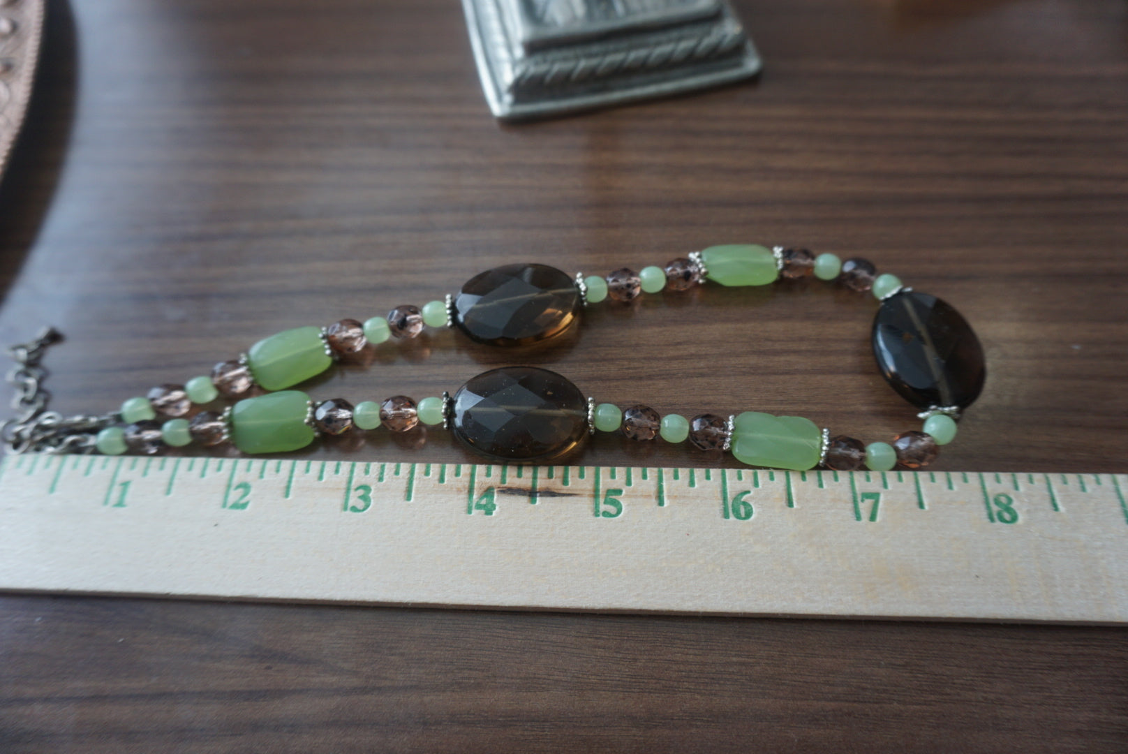 Elegant Beaded Necklace with Green and Brown Accents