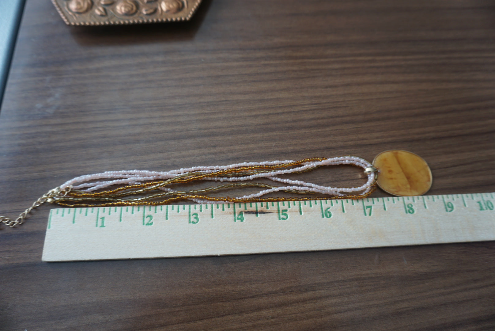 Multi-Strand Gold and Beige Pendant Necklace