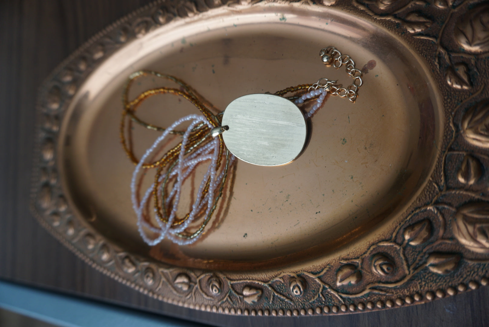 Multi-Strand Gold and Beige Pendant Necklace