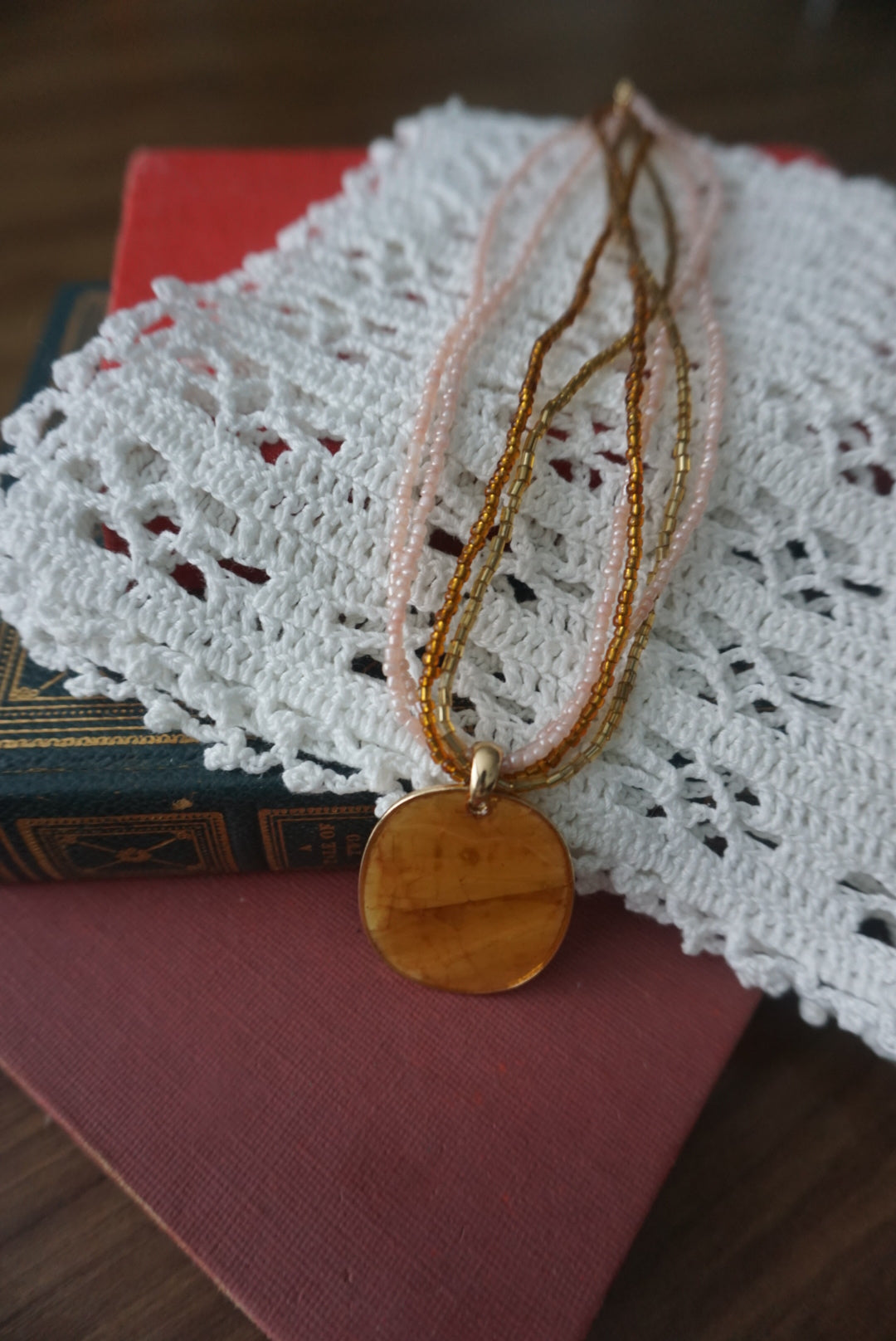 Multi-Strand Gold and Beige Pendant Necklace