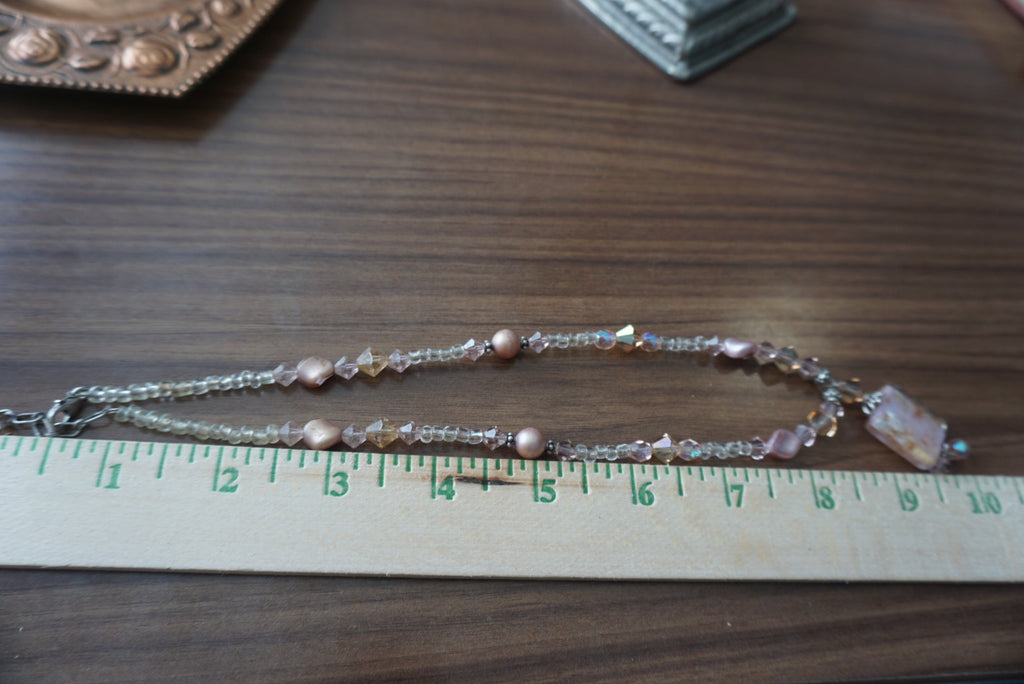 Elegant Beaded Necklace with Gold Pendant