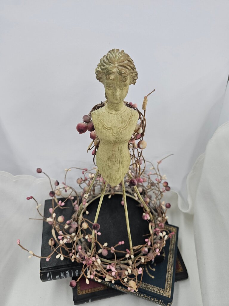 Decorative Figurine with Floral Accents