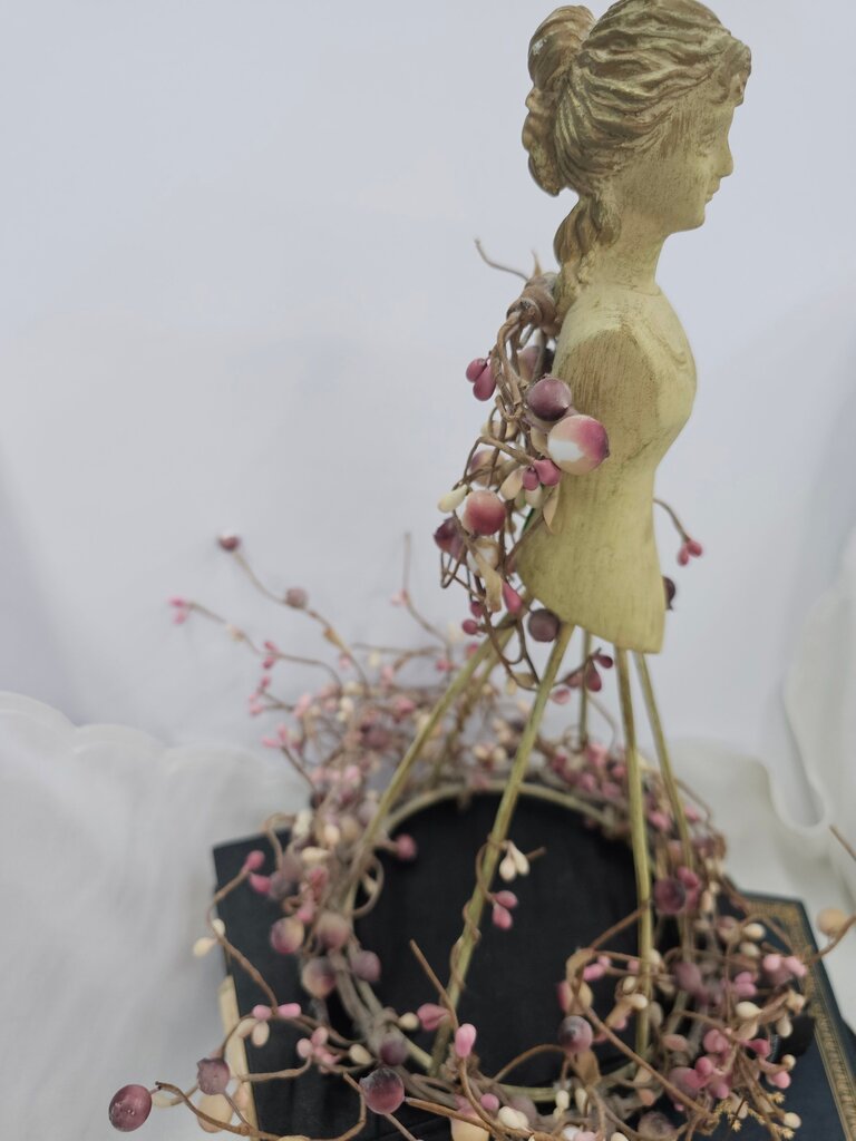 Decorative Figurine with Floral Accents