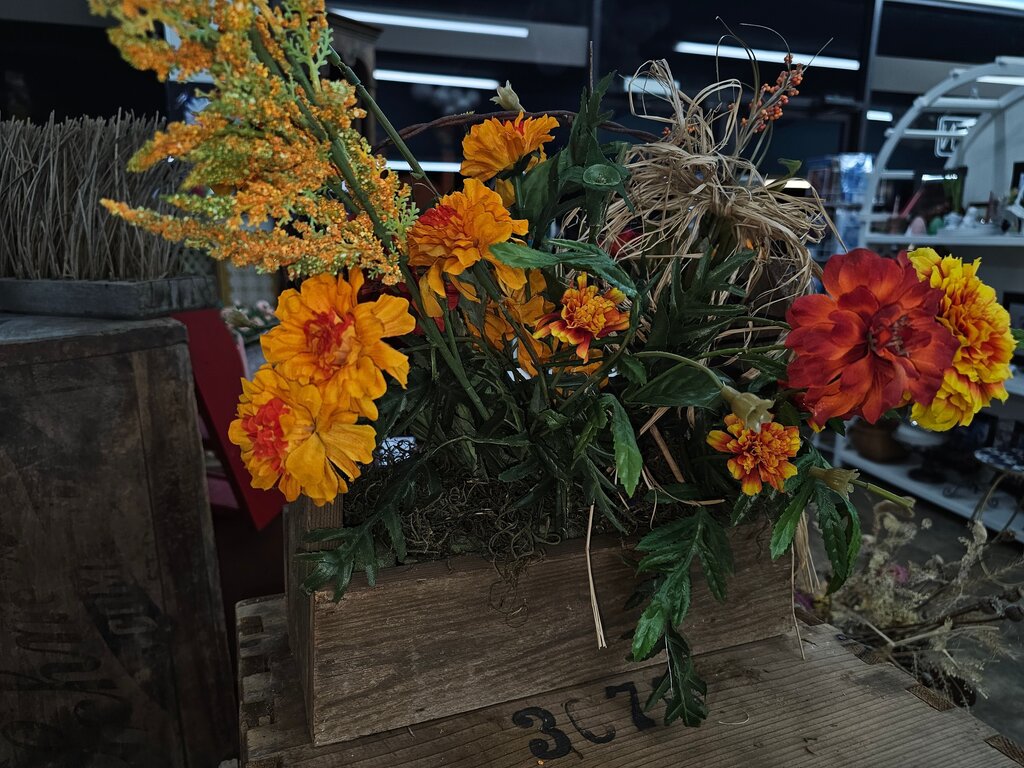Primitive style wood box with Barbed Wire Flower Garden Box Artificial Floral Arrangement with Yellow and Orange Flowers
