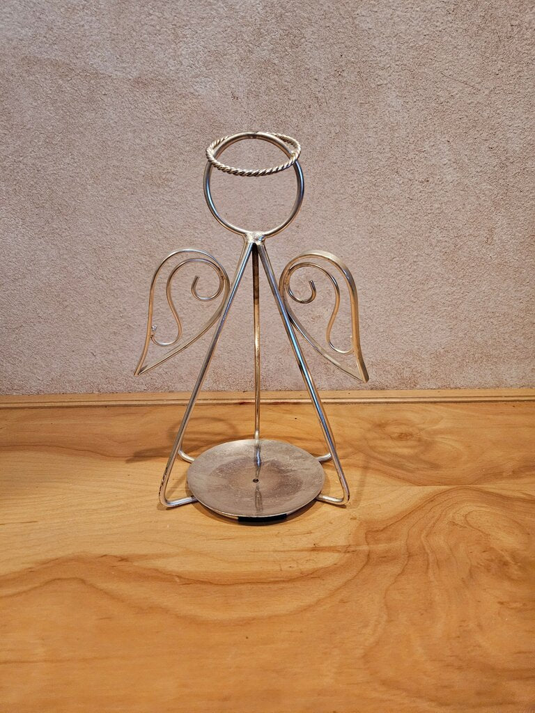 Medium welded metal angel candle holder for pillar candles. Simple, yet elegant