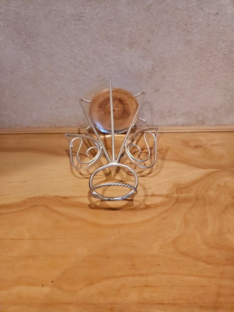 Medium welded metal angel candle holder for pillar candles. Simple, yet elegant