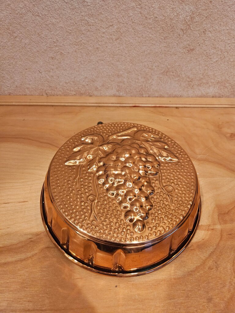 Beautiful rustic copper mold. This Charming rustic French country inspired mid-century copper mold depicts a healthy cluster of grapes