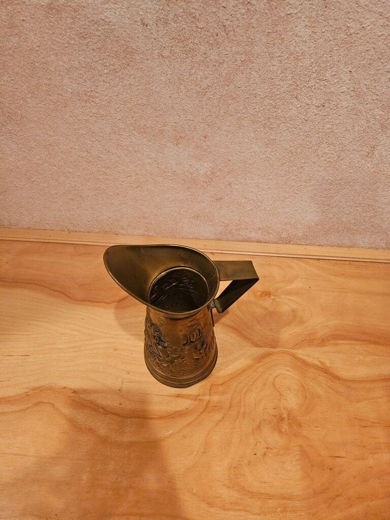 Larger Brass Stamped Motif Pitcher Vase with bar scene