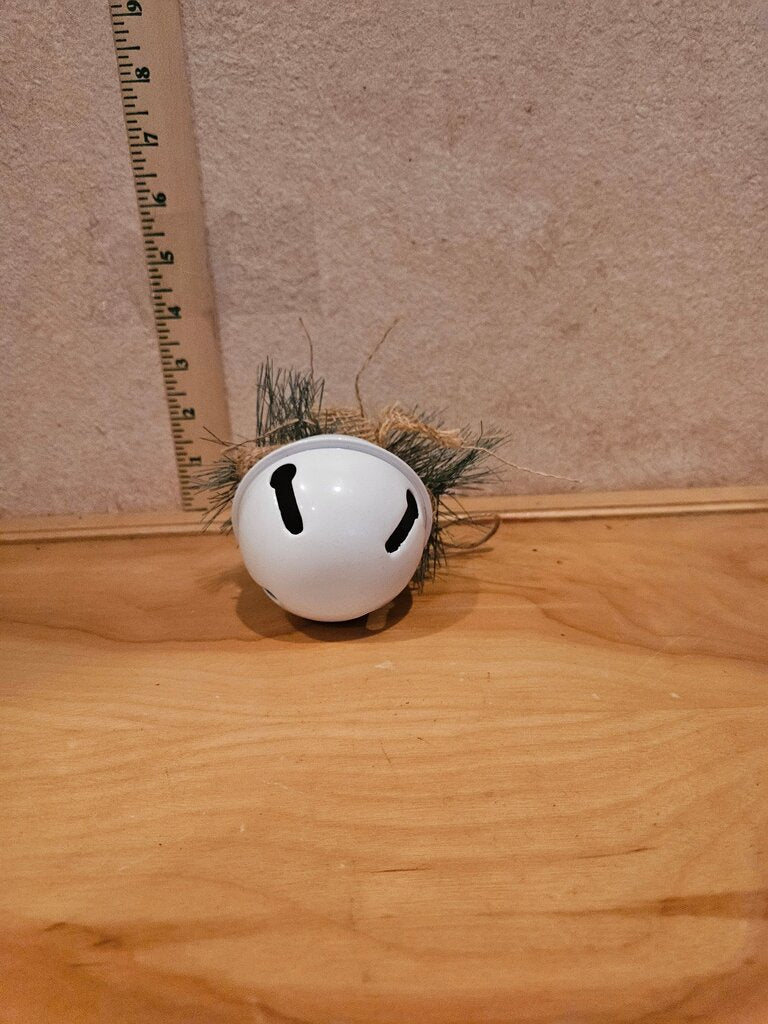 Decorative White Bell with Pinecones and Burlap