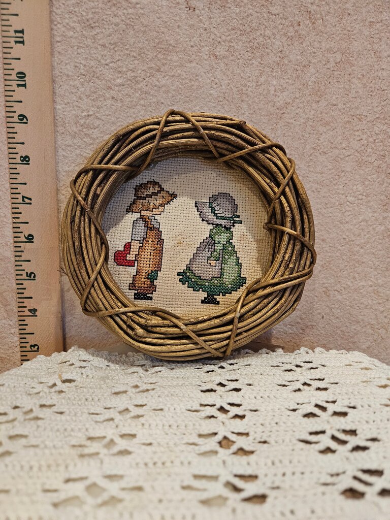 Vintage Finished Cross Stitch / Crewel Featuring folk art couple, in a grapevine circle-shaped wreath frame