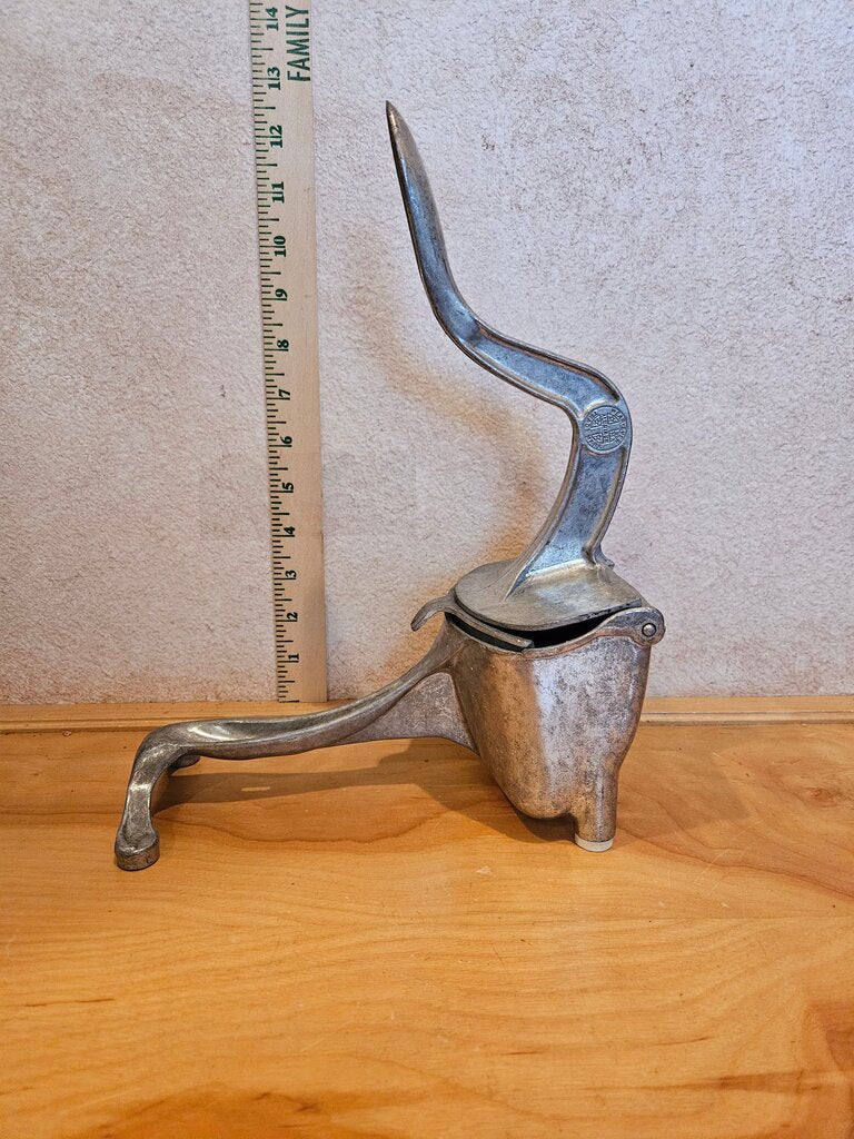 Vintage mid century modern Table top Orange handpress Juicer Pure Cast Aluminum