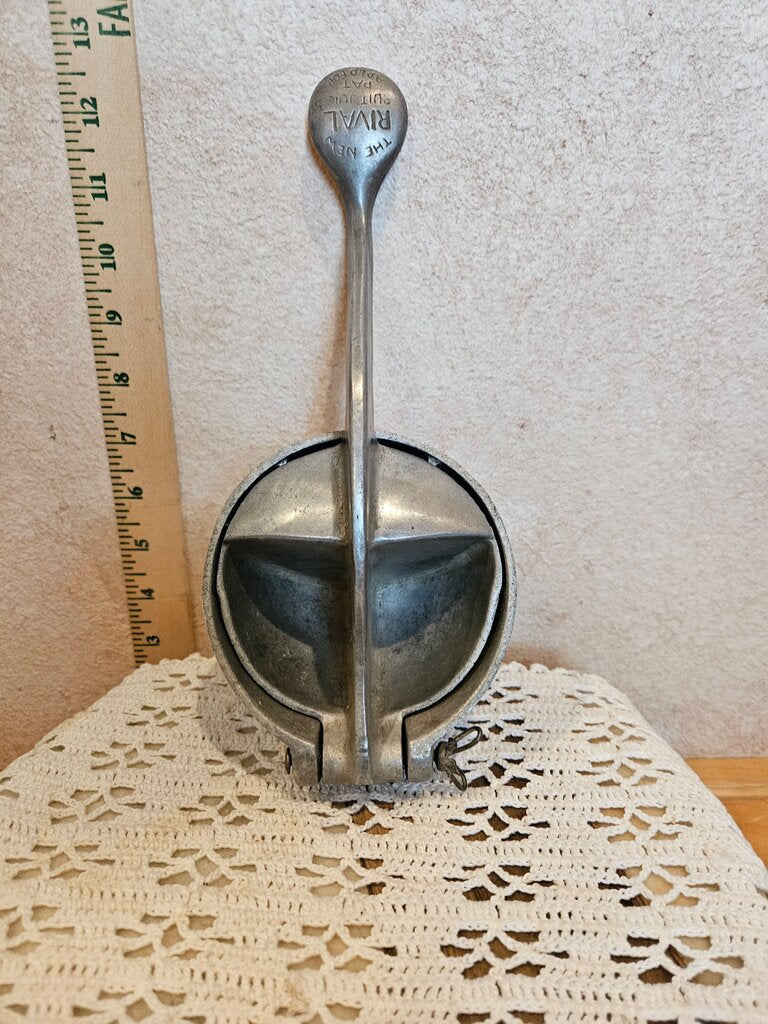 Vintage Metal Rival Fruit Tabletop Juicer on a riser, removeable base
