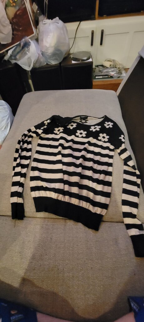 Black and White Striped Pullover Sweater with Floral Design